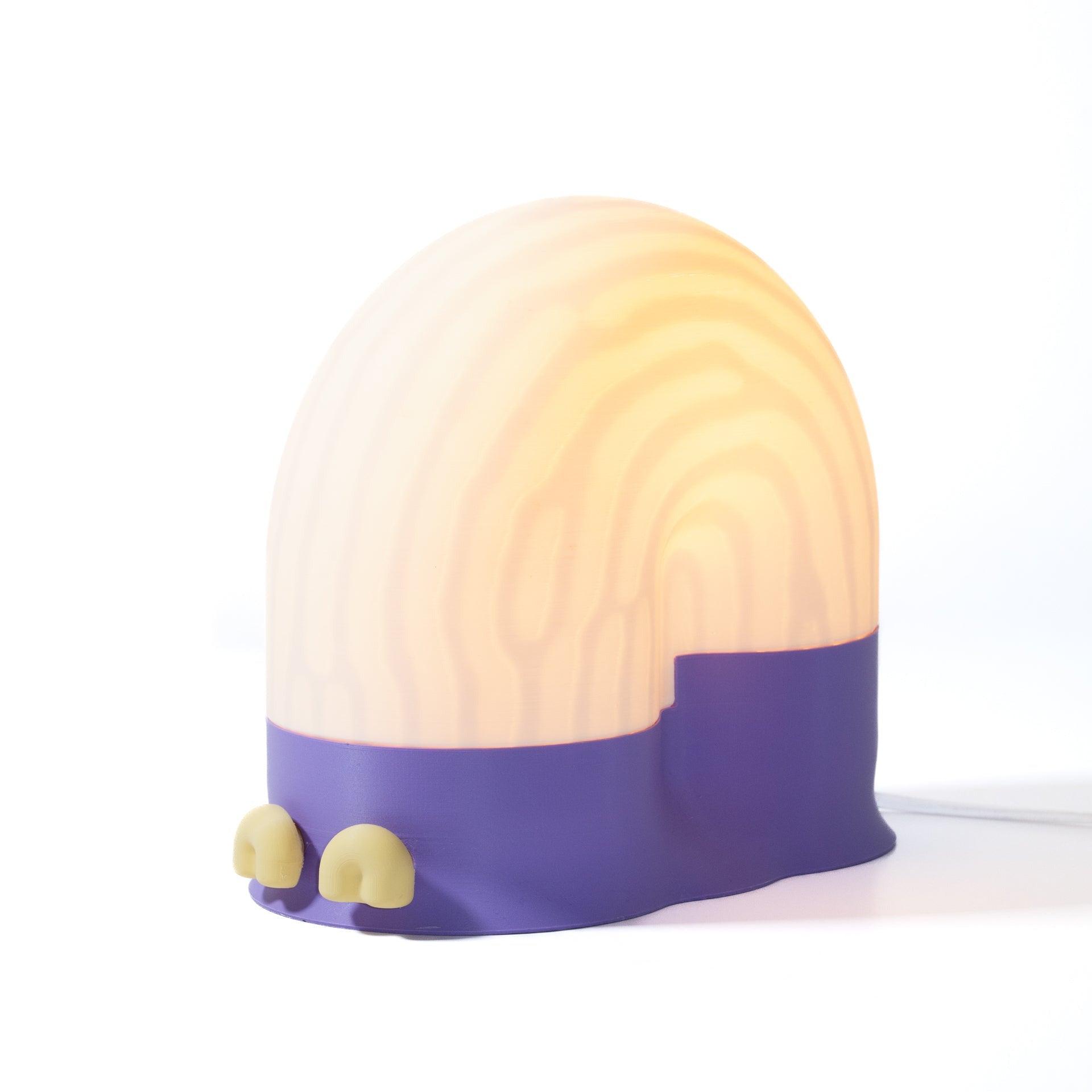 Round lamp with a purple base and white top on a white background