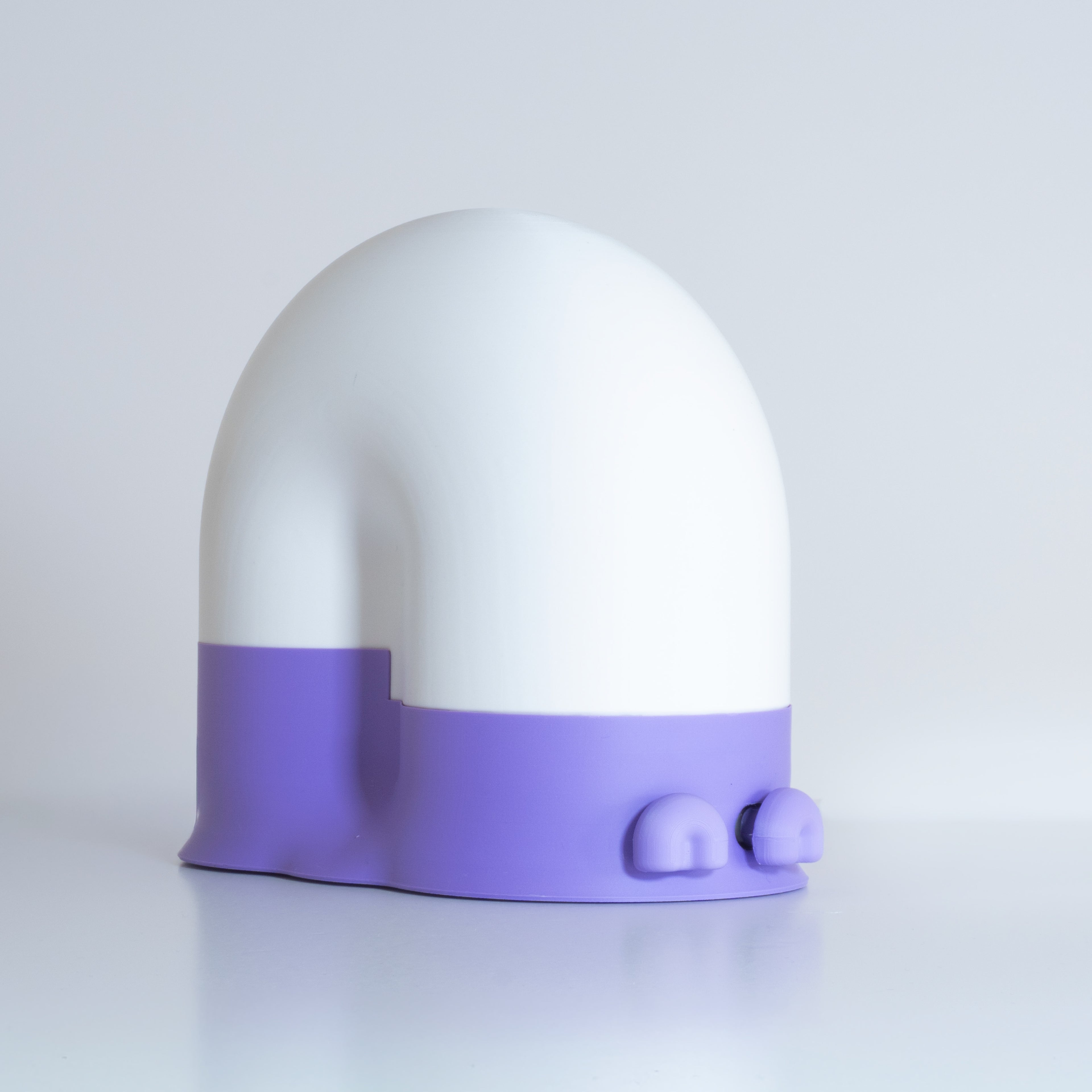 White snail-shaped lamp with a lavender base and lavender eyes on a light gray background