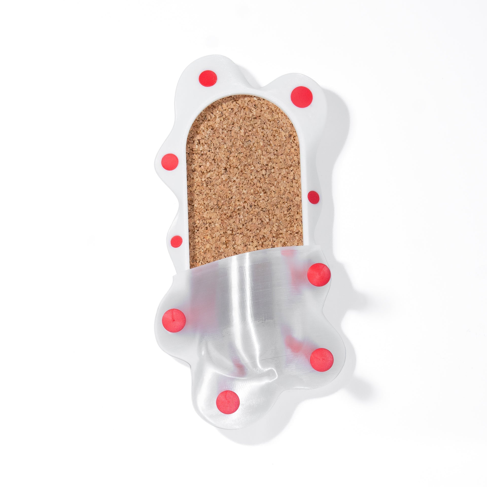 Decorative cork  panel with red polka dots on a white background