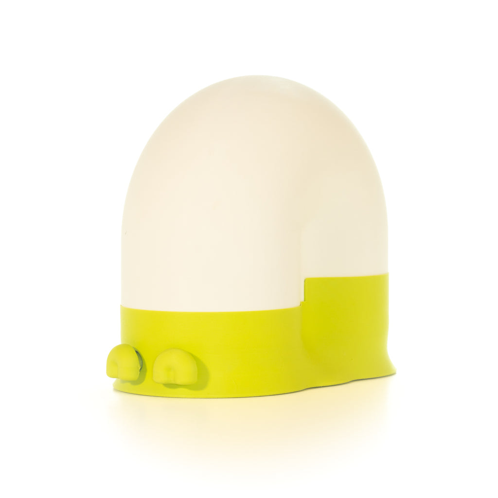 White snail-shaped lamp with a lime green base and lime green eyes on a light gray background